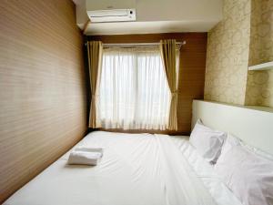 Signature 2BR at Apartment Tamansari Panoramic By Travelio