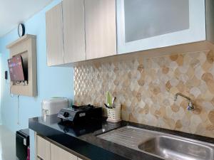 Minimalist Studio Grand Sentraland Karawang Apartment By Travelio