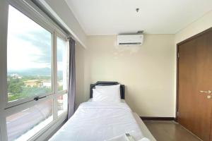 Spacious 2BR Apartment at El Royale near BIP By Travelio