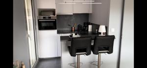 Appartements Les Glycines : photos des chambres