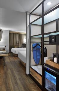 Queen Room with Two Queen Beds and Adapted Tub - Mobility and Hearing Accessible room in AC Hotel by Marriott Orlando Lake Buena Vista