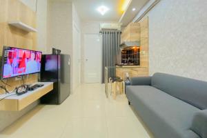 Comfort 2BR Green Pramuka City Apartment By Travelio