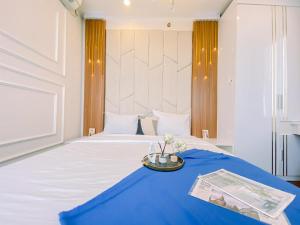 Good and Warm 2BR at Transpark Cibubur Apartment By Travelio