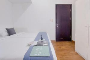 Cozy Living 2BR Apartment at Casa de Parco By Travelio