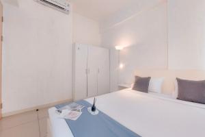 Good Place and Homey 1BR at Tree Park City BSD Apartment By Travelio