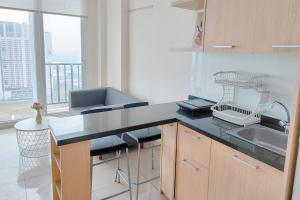 Good Place and Homey 1BR at Tree Park City BSD Apartment By Travelio