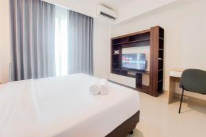 Comfort Living 1BR without Living Room at Bintaro Embarcadero Apartment By Travelio