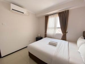 Spacious and Minimalist 3BR at Gateway Pasteur Apartment By Travelio