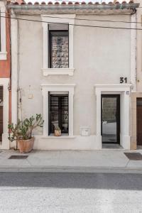 Maisons de vacances Maison avec bassin dans les remparts : photos des chambres