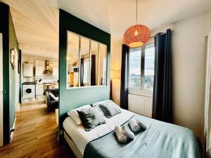 Appartements L ESCALE, grand studio pres de la gare : photos des chambres