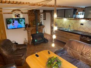 Dom z plażą nad jeziorem Dejnowa