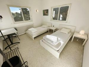 Appartements Haut de villa, pleine vue mer : photos des chambres