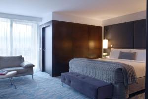 Junior Suite room in Renaissance Paris Arc de Triomphe Hotel