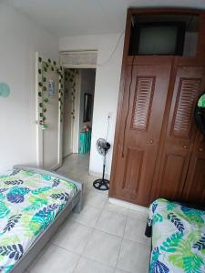 MANOA "Lugar de descanso" HABITACION CON VISTA A LA CIUDAD, FRESCO Y VENTILADO