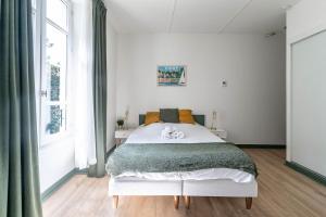 Appartements Residence Bains Callou situee face aux thermes : photos des chambres