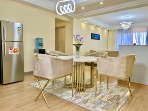 the serene suites executively furnished two bedroom apartment with amazing city views,heated swimming pool ,ample parking space and fully equipped gym