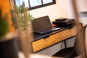 Appartements Le Coup de Coeur - Proche Sanctuaire et Commerces - WiFi - Neuf : photos des chambres