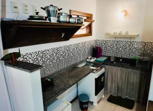 Flat Oxóssi, condomínio beira-mar, varandão e piscina