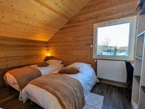 Maisons de vacances Chalet Nature avec Sauna et WIFI pres Gerardmer - FR-1-589-777 : photos des chambres