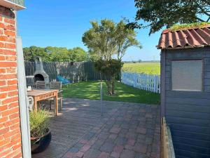 Ferienhaus Huus an`t Diek, Maisonette Wohnung in Deichnähe, Nähe Norddeich