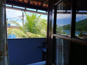 Casa na Ilha Grande ,areia e maré