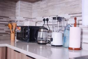 The comfort executive loft two bedroomed apartment with amazin breathtaking city views ,heated swimming pool,gym and rooftop chill spot with offers breathtaking city views ,private ample parking space with designated child playground area