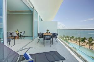 Maritima Beachfront Condos with Gym, 2 Pools, Rooftop and Bar