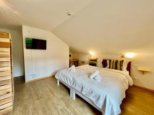 Appartements Le Grand Loup, appartement neuf avec bain nordique : photos des chambres