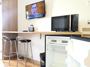 Pertinho da Paulista, cama King e sacada gostosa!