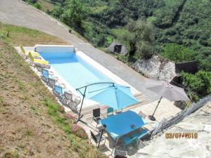 Villas Villa spacieuse a Vieillevie avec piscine privee - 180 m² : photos des chambres