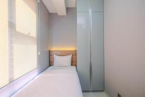 Fully Furnished with Cozy Design 2BR Apartment Transpark Cibubur By Travelio