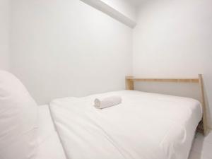 Simply 2BR at Jarrdin Cihampelas Apartment By Travelio