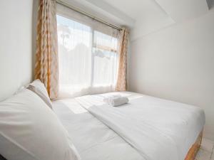 Simply 2BR at Jarrdin Cihampelas Apartment By Travelio