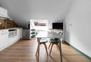 Appartements Residence Bains Callou situee face aux thermes : photos des chambres