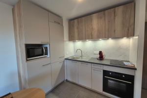 Appartements NEW ! Altitude 1327 Residence at the foot of the slopes : photos des chambres