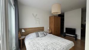 Appartements Rouge Canneberge -8 personnes- 84m2 Vue degagee Setaz : photos des chambres