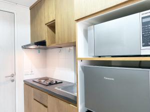 Good and Comfy Studio at Azalea Suites Apartment By Travelio