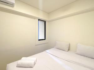 Homey 2BR at Meikarta Apartment By Travelio