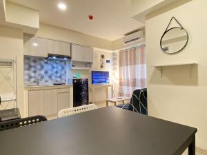 Homey 2BR at Meikarta Apartment By Travelio