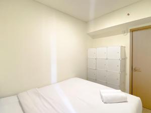 Homey 2BR at Meikarta Apartment By Travelio