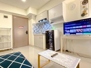 Homey 2BR at Meikarta Apartment By Travelio