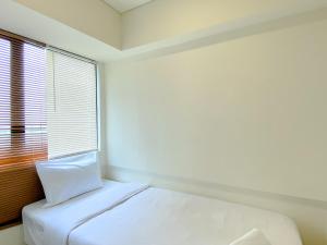 Homey 2BR at Meikarta Apartment By Travelio