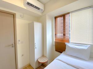 Homey 2BR at Meikarta Apartment By Travelio