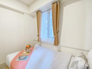 Comfort 2BR Apartment at Meikarta Cikarang By Travelio