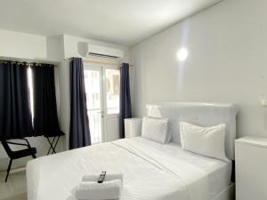 Cozy Living Studio Grand Sentraland Karawang Apartment By Travelio