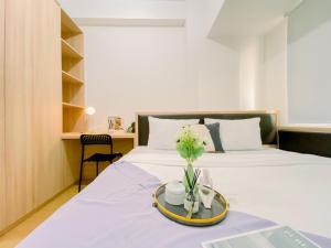 Modern and Serene Look 2BR Tokyo Riverside PIK 2 Apartment By Travelio