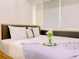 Modern and Serene Look 2BR Tokyo Riverside PIK 2 Apartment By Travelio