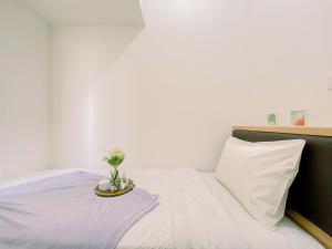 Modern and Serene Look 2BR Tokyo Riverside PIK 2 Apartment By Travelio