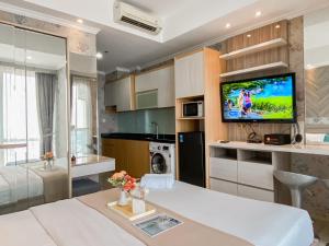 Good Deal and Scenic Studio at Menteng Park Apartment By Travelio