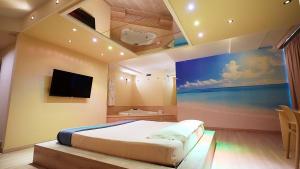 Suite mit Kingsize-Bett mit Whirlpool